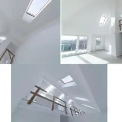 Jasne, nowoczesne wnętrze z licznymi oknami dachowymi, które tworzą grę światła. Widoczne drewniane balustrady i białe ściany.